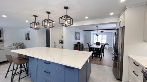 Inside image of a house with some lights and table chairs